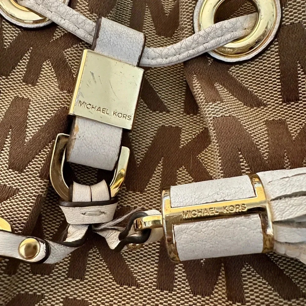 Michael Kors Monogram Drawstring Bucket Brown Mini WithTassel Crossbody Bag